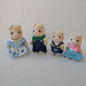 Charming Pig Family Doll Set with Blue and Pink Outfits